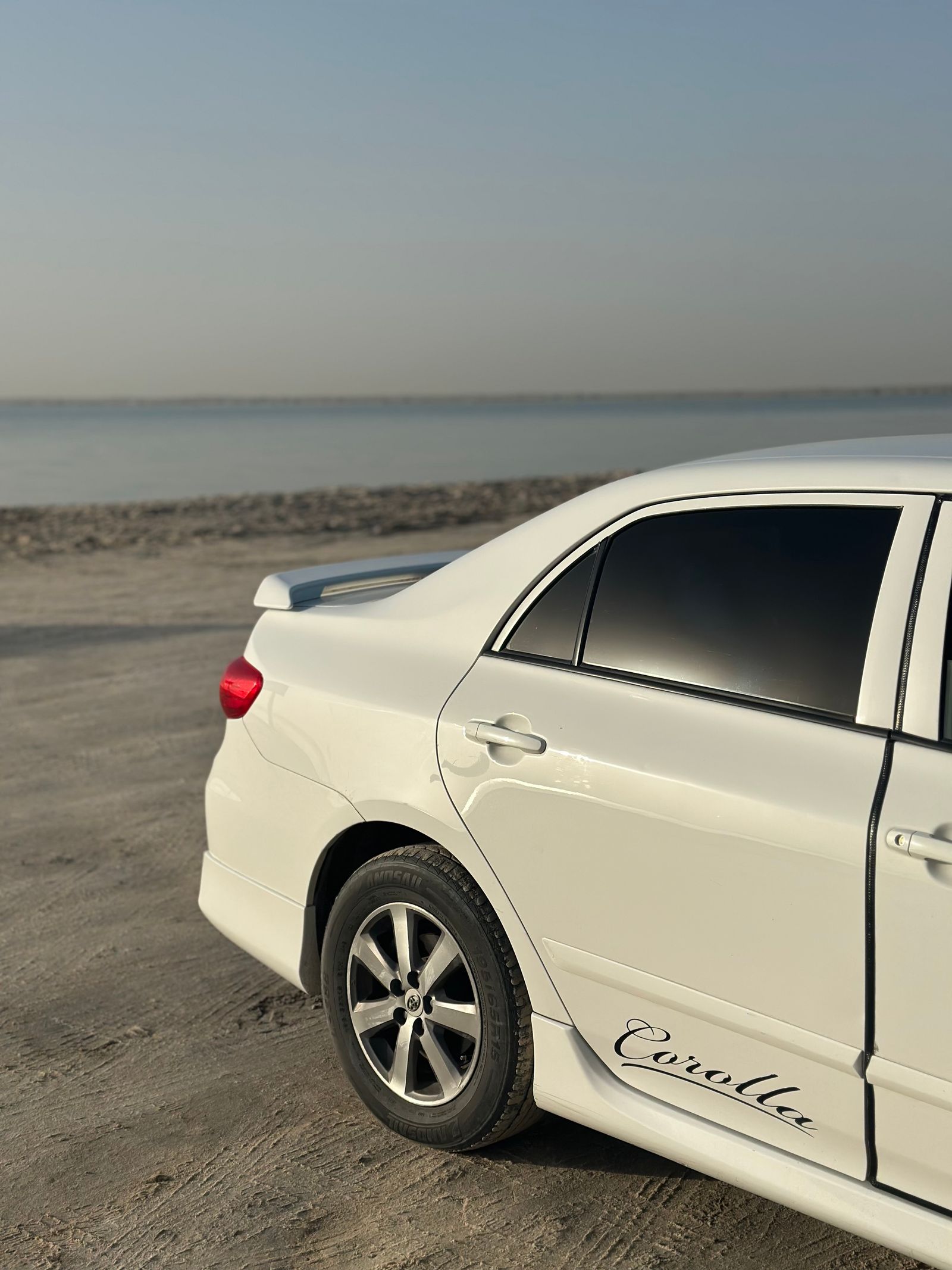 White sedan car, side view