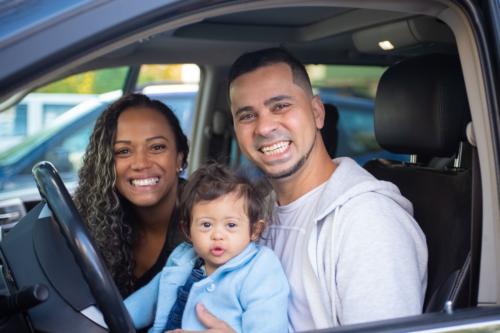 Happy family inside a car