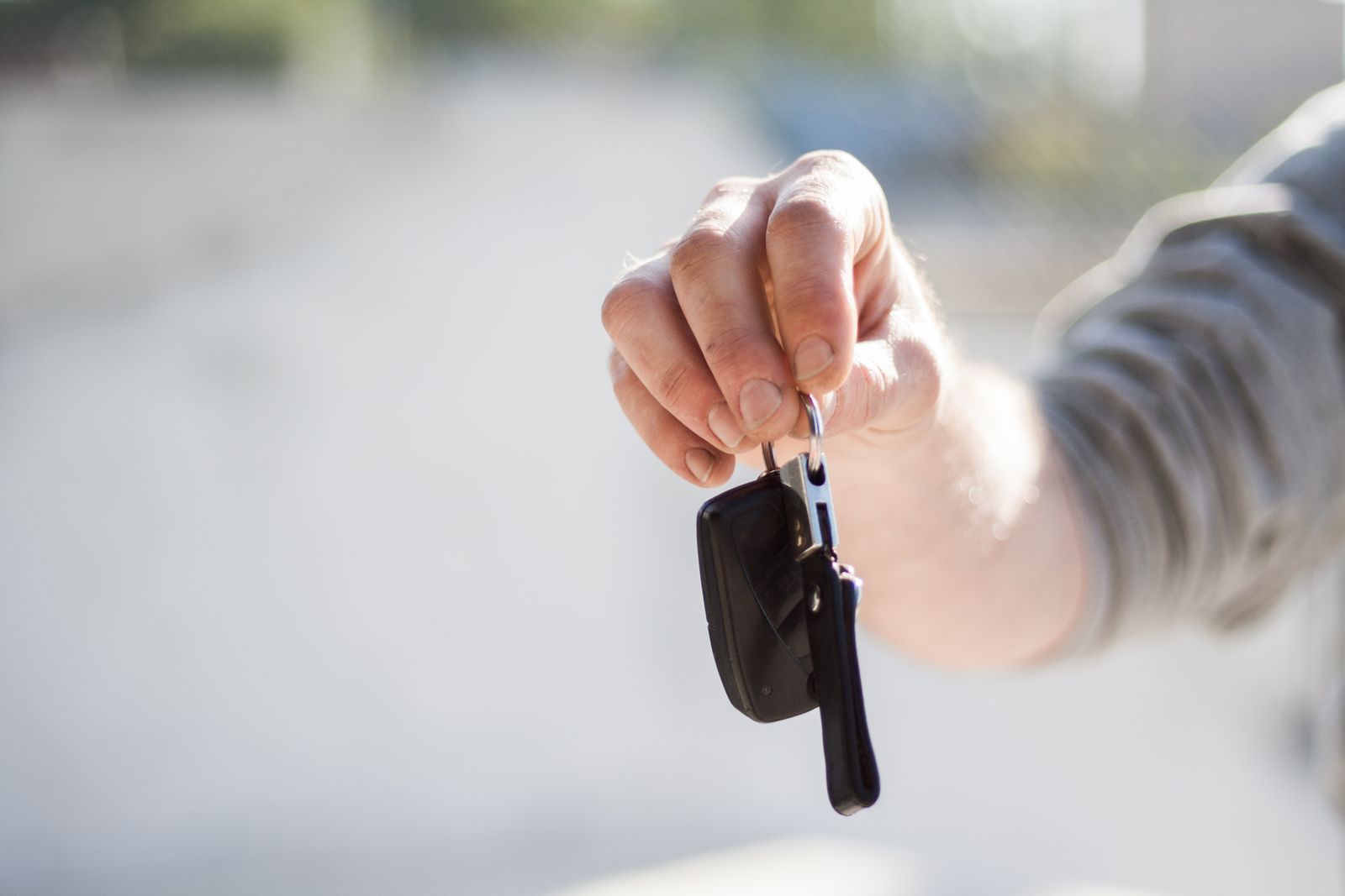 Handing over car keys to a customer