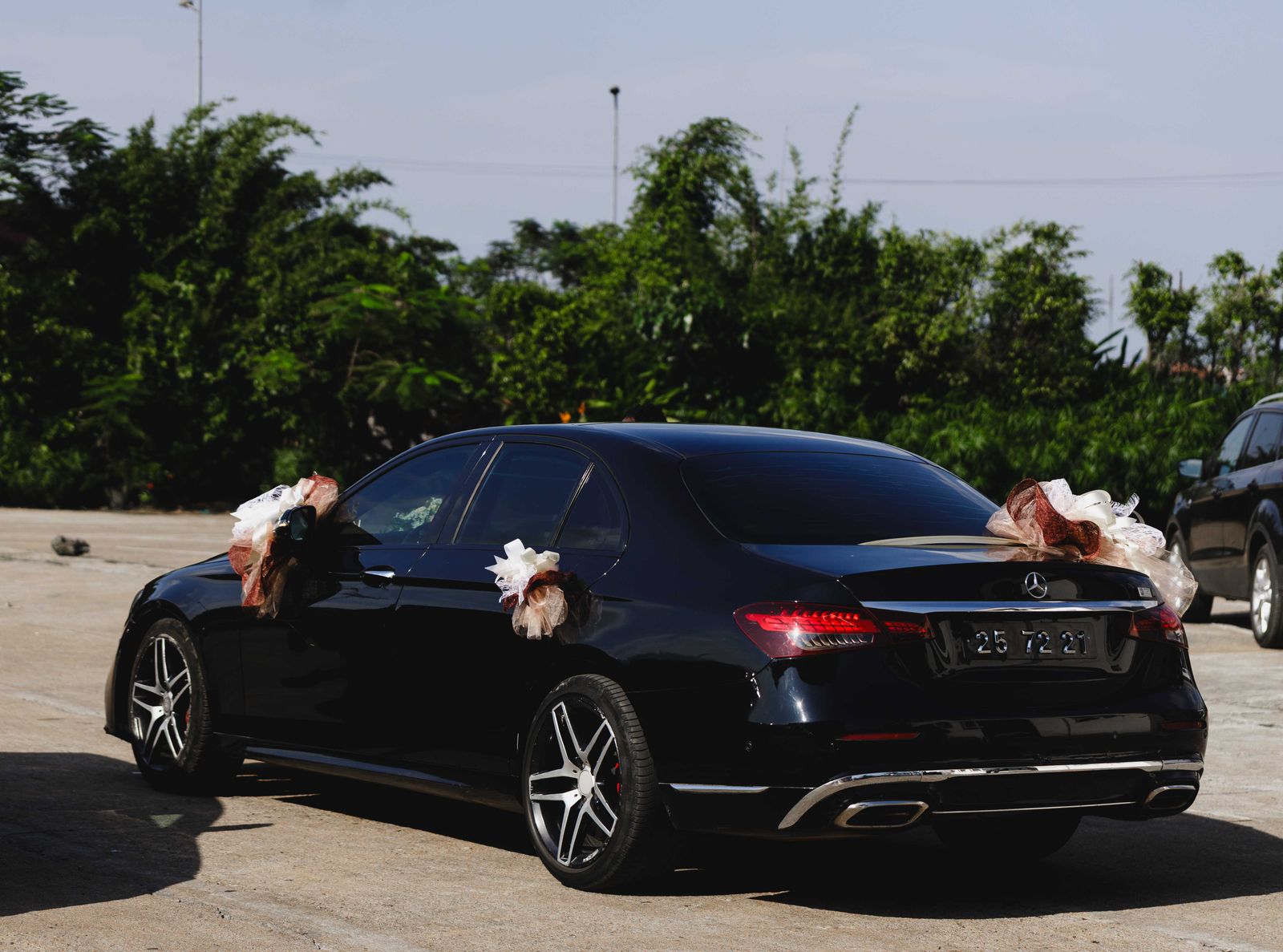 Black Mercedes with wedding ribbons